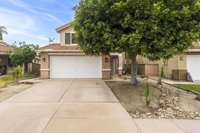 305 Cobblestone Pl, Santee, CA 92071 - obstructed view of property featuring stucco siding, a garage, driveway, and a tile roof