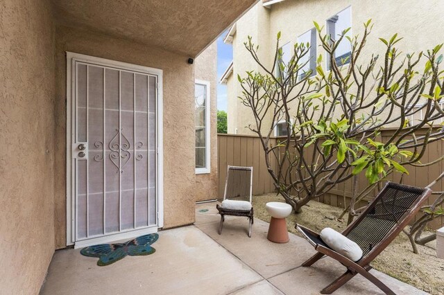 305 Cobblestone Pl, Santee, CA 92071 - view of exterior entry featuring a patio area and stucco siding