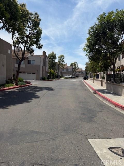 19 Softwind, Aliso Viejo, CA 92656 - view of asphalt street featuring a residential view, curbs, and sidewalks