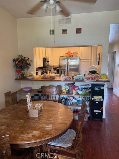 19 Softwind, Aliso Viejo, CA 92656 - dining space with ceiling fan, dark wood finished floors, and a high ceiling