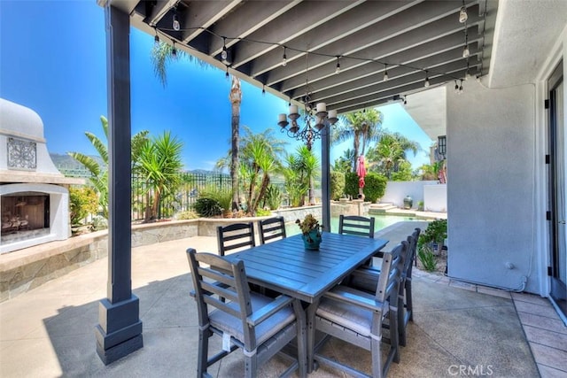 12 Thorn Oak, Rancho Santa Margarita, CA 92679 - fenced backyard with a patio, exterior fireplace, and outdoor dining area