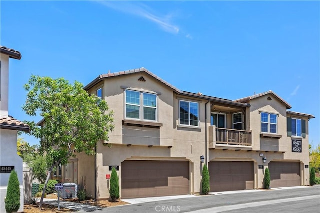 45437 Calle Cirros, Temecula, CA 92592 - multi unit property with stucco siding, a garage, and a tiled roof