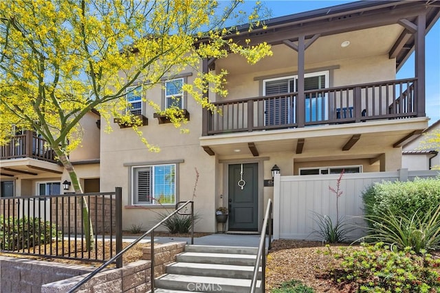 45437 Calle Cirros, Temecula, CA 92592 - townhome / multi-family property with a balcony and stucco siding