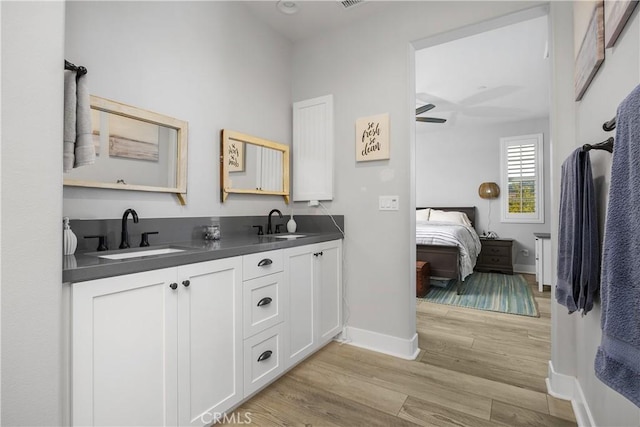 45437 Calle Cirros, Temecula, CA 92592 - ensuite bathroom featuring double vanity, wood finished floors, and ceiling fan