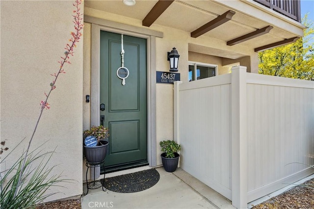 45437 Calle Cirros, Temecula, CA 92592 - view of exterior entry with stucco siding and a balcony