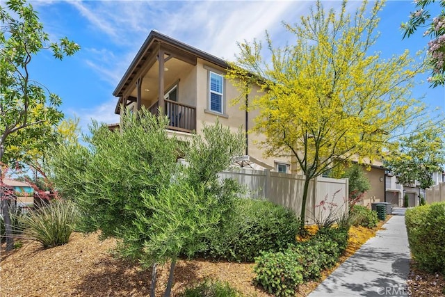45437 Calle Cirros, Temecula, CA 92592 - view of side of property featuring stucco siding and a central air condition unit
