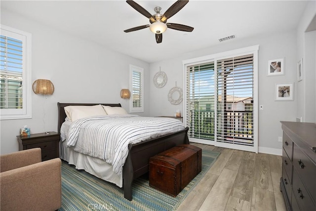 45437 Calle Cirros, Temecula, CA 92592 - bedroom featuring access to exterior, wood finished floors, and ceiling fan