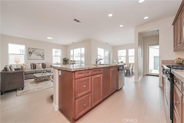 6611 Eucalyptus Ave, Chino, CA 91710 - kitchen featuring stainless steel appliances, a sink, plenty of natural light, open floor plan, and recessed lighting
