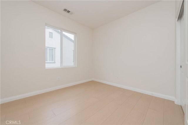 6611 Eucalyptus Ave, Chino, CA 91710 - unfurnished room with baseboards and light wood finished floors