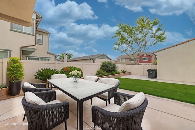6611 Eucalyptus Ave, Chino, CA 91710 - fenced backyard with outdoor dining area and a patio