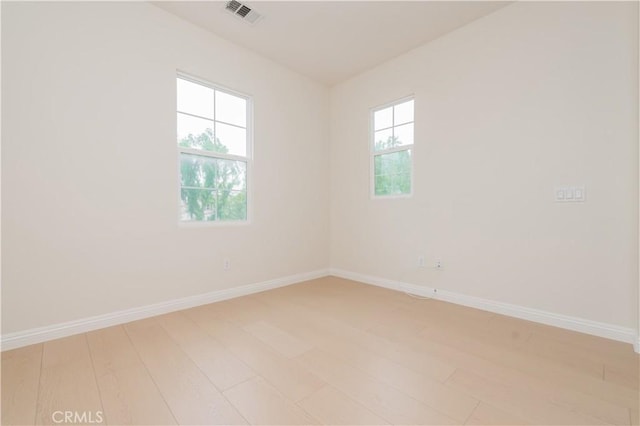 6611 Eucalyptus Ave, Chino, CA 91710 - empty room with light wood-style flooring and baseboards