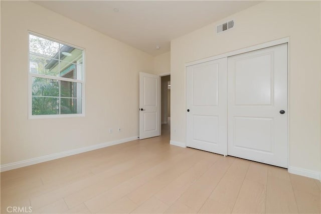 6611 Eucalyptus Ave, Chino, CA 91710 - unfurnished bedroom featuring light wood-style floors, baseboards, and a closet