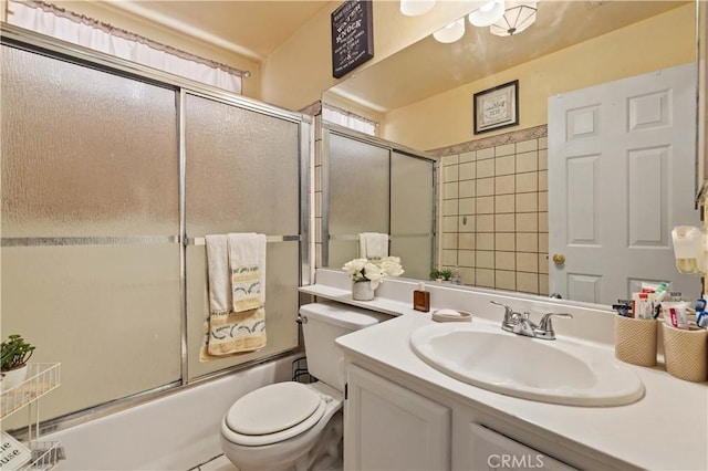 36903 Firethorn St, Palmdale, CA 93550 - bathroom with vanity, toilet, and bath / shower combo with glass door