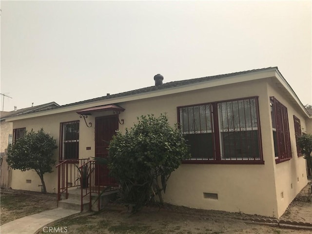 8106 San Miguel Ave, South Gate, CA 90280 - view of front facade with crawl space and stucco siding