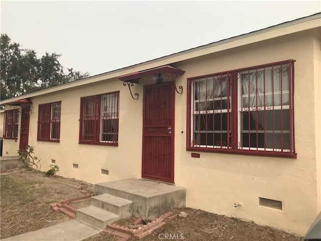 8106 San Miguel Ave, South Gate, CA 90280 - doorway to property with crawl space and stucco siding