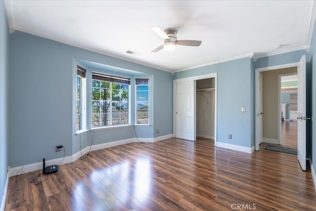 54326 Wildwood Springs Trl, North Fork, CA 93643 - unfurnished bedroom featuring crown molding, wood finished floors, baseboards, a closet, and ceiling fan