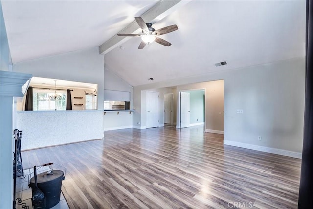 54326 Wildwood Springs Trl, North Fork, CA 93643 - unfurnished living room with beamed ceiling, baseboards, wood finished floors, a ceiling fan, and a chandelier