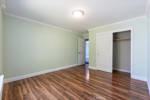 54326 Wildwood Springs Trl, North Fork, CA 93643 - unfurnished bedroom with dark wood-style flooring, ornamental molding, baseboards, and a closet