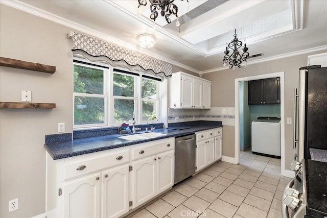 54326 Wildwood Springs Trl, North Fork, CA 93643 - kitchen with washer / dryer, appliances with stainless steel finishes, a chandelier, a sink, and white cabinetry