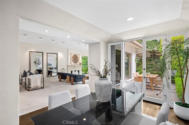 6 Rue Marseilles, Newport Beach, CA 92660 - dining area with french doors, wood finished floors, recessed lighting, and a fireplace