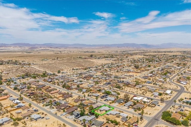 6064 Cahuilla Ave Unit 29, Palms, CA 92277 - aerial overview of property's location featuring a mountainous background and a desert landscape