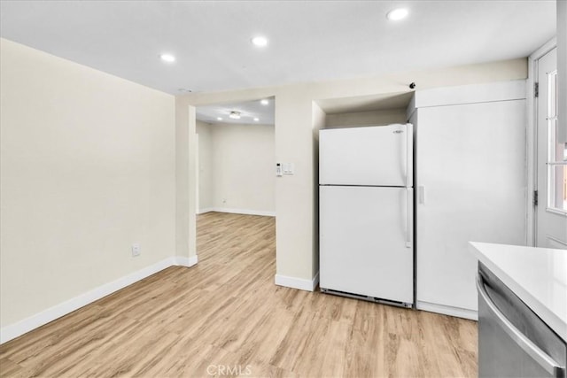 6064 Cahuilla Ave Unit 29, Palms, CA 92277 - kitchen featuring freestanding refrigerator, stainless steel dishwasher, light wood-style flooring, recessed lighting, and baseboards