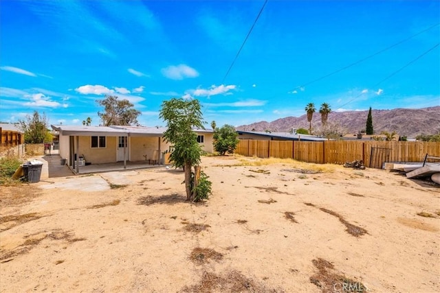 6064 Cahuilla Ave Unit 29, Palms, CA 92277 - view of yard featuring a mountain view and a patio