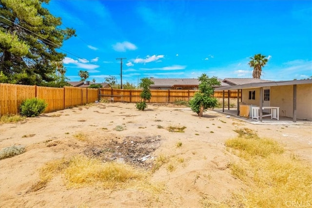 6064 Cahuilla Ave Unit 29, Palms, CA 92277 - fenced backyard featuring a patio