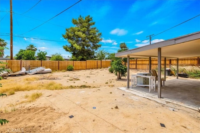 6064 Cahuilla Ave Unit 29, Palms, CA 92277 - fenced yard featuring a patio