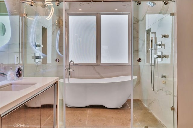 719 1st Pl, Hermosa Beach, CA 90254 - bathroom with tile walls, vanity, a freestanding tub, a stall shower, and tile patterned floors