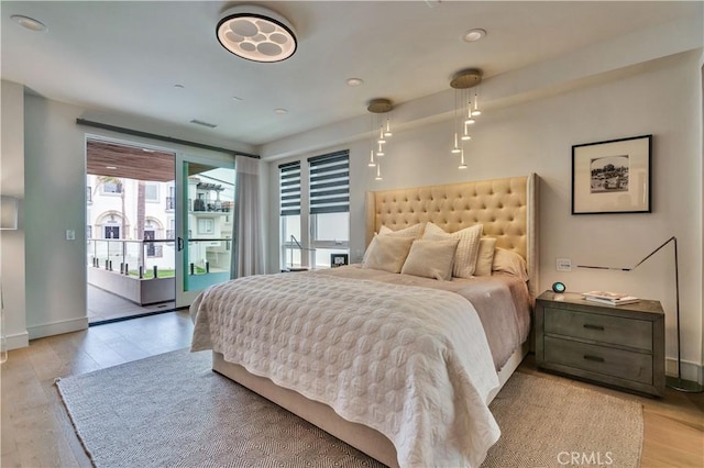 719 1st Pl, Hermosa Beach, CA 90254 - bedroom featuring access to exterior, light wood-style floors, recessed lighting, and baseboards