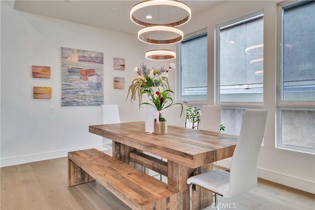 719 1st Pl, Hermosa Beach, CA 90254 - dining space featuring baseboards and wood finished floors
