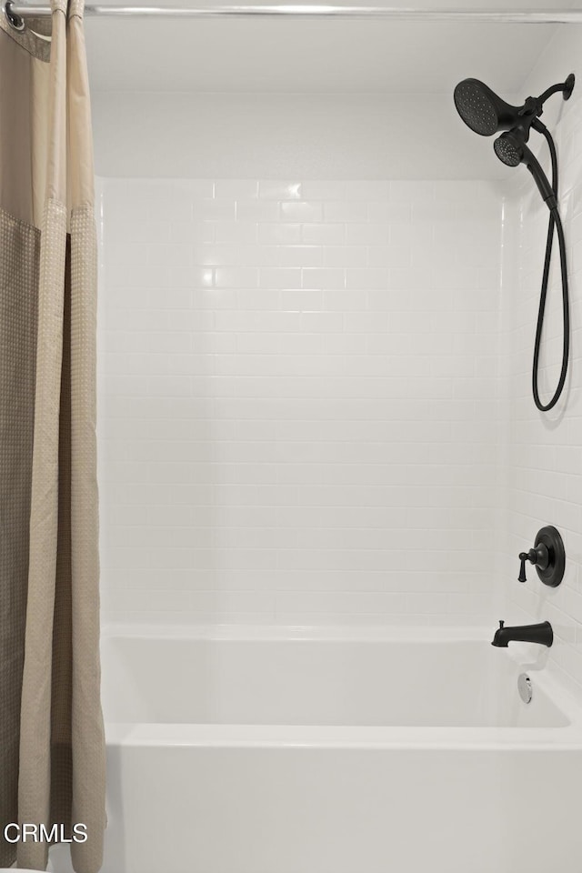 2850 Wagon Wheel Rd Unit 302, Oxnard, CA 93036 - bathroom with shower / bath combo with shower curtain
