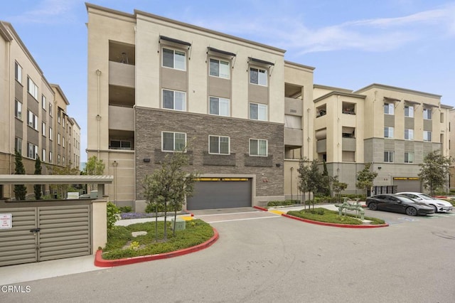 2850 Wagon Wheel Rd Unit 302, Oxnard, CA 93036 - view of property featuring a garage