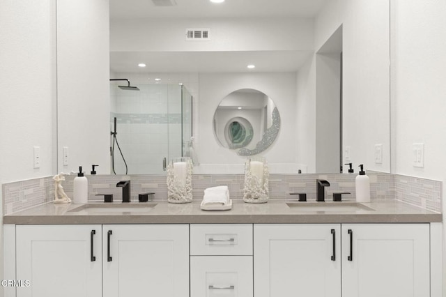 2850 Wagon Wheel Rd Unit 302, Oxnard, CA 93036 - full bathroom with double vanity, a stall shower, tasteful backsplash, and recessed lighting