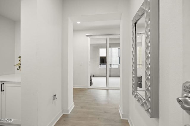 2850 Wagon Wheel Rd Unit 302, Oxnard, CA 93036 - hall with light wood-style flooring and baseboards