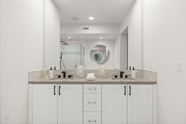 2850 Wagon Wheel Rd Unit 302, Oxnard, CA 93036 - bathroom with a stall shower, double vanity, and recessed lighting