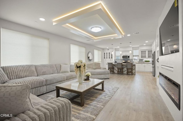 2850 Wagon Wheel Rd Unit 302, Oxnard, CA 93036 - living area featuring light wood-style floors and recessed lighting
