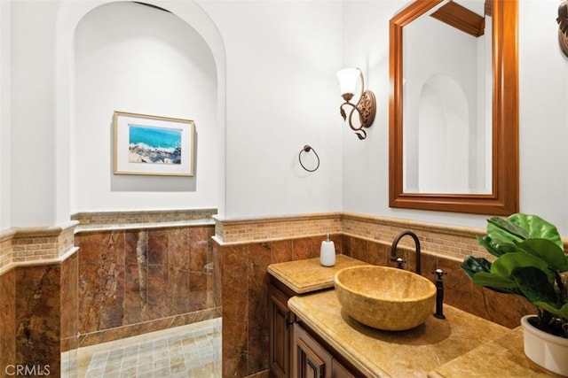 97 Canyon Crk, Irvine, CA 92603 - bathroom with vanity, wainscoting, and tile walls