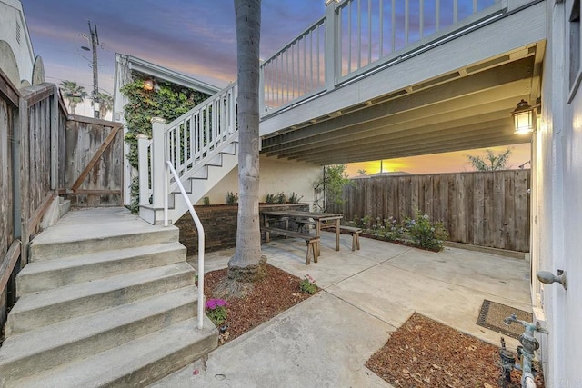 644 Grant St, Oceanside, CA 92054 - patio terrace at dusk featuring stairway, a patio, and outdoor dining space