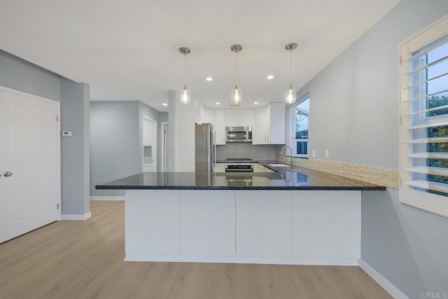 644 Grant St, Oceanside, CA 92054 - kitchen featuring stainless steel appliances, light wood finished floors, plenty of natural light, and recessed lighting