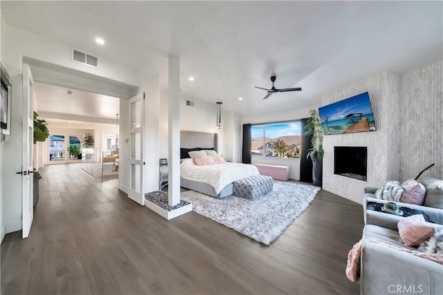 30402 Marbella, San Juan Capistrano, CA 92675 - bedroom with dark wood-type flooring, recessed lighting, a fireplace, and ceiling fan