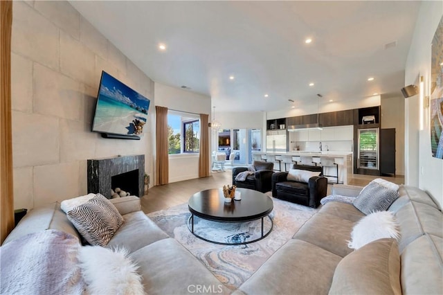 30402 Marbella, San Juan Capistrano, CA 92675 - living room with recessed lighting, light wood-style flooring, and a fireplace