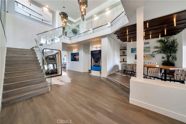 30402 Marbella, San Juan Capistrano, CA 92675 - foyer featuring stairs, wood finished floors, and a towering ceiling