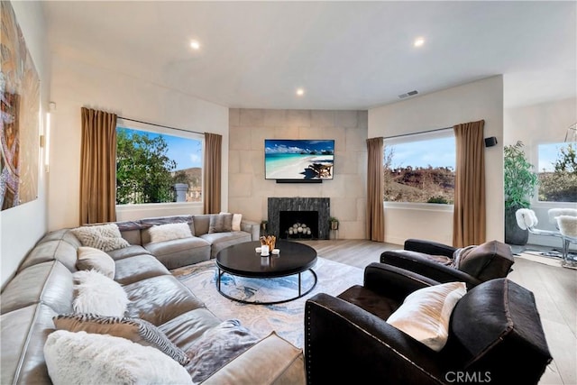 30402 Marbella, San Juan Capistrano, CA 92675 - living area featuring wood finished floors, recessed lighting, and a fireplace