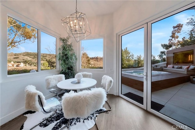 30402 Marbella, San Juan Capistrano, CA 92675 - sunroom with healthy amount of natural light and a chandelier