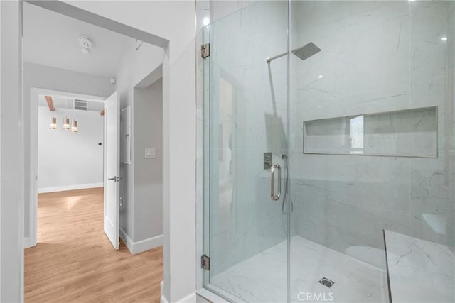 5624 Freeman Ave, La Crescenta, CA 91214 - full bath with wood finished floors, a marble finish shower, baseboards, and a chandelier
