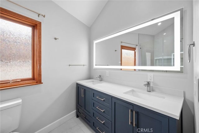 5624 Freeman Ave, La Crescenta, CA 91214 - full bath with baseboards, marble finish flooring, double vanity, lofted ceiling, and toilet