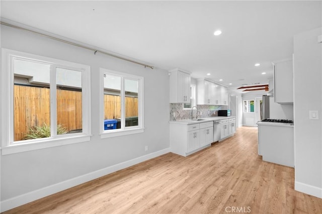 5624 Freeman Ave, La Crescenta, CA 91214 - kitchen featuring dishwasher, a sink, baseboards, white cabinetry, and recessed lighting