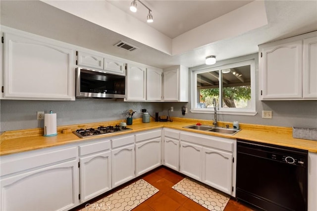 14650 Harding St, Hesperia, CA 92345 - kitchen featuring stainless steel appliances, a sink, and white cabinetry